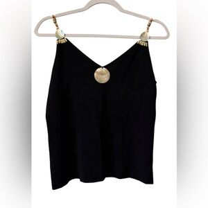 Ziani Couture women’s Medium sleeveless v-neck black top with a front medallion